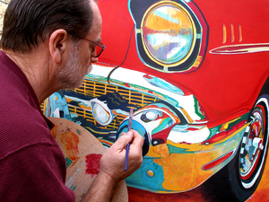 Jack painting a red Chevrolet